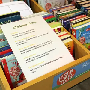 Ein DinA4-Zettel mit Challenge-Infos, z.B. "Sachbuch: Was hast du aus dem Buch gelernt? Schreibe bitte 3 bis 5 Sätze darüber"